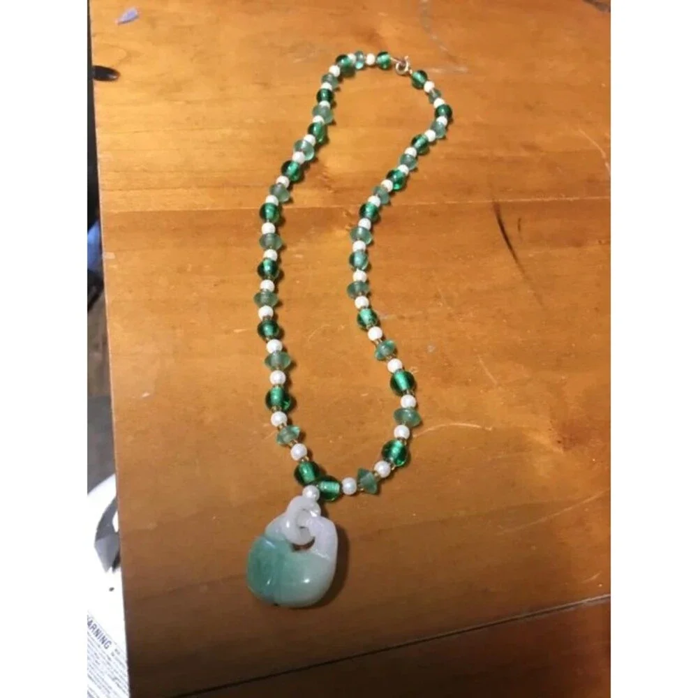 Jade and beads necklace, amazing artistry into that pendant,   Look Closer.